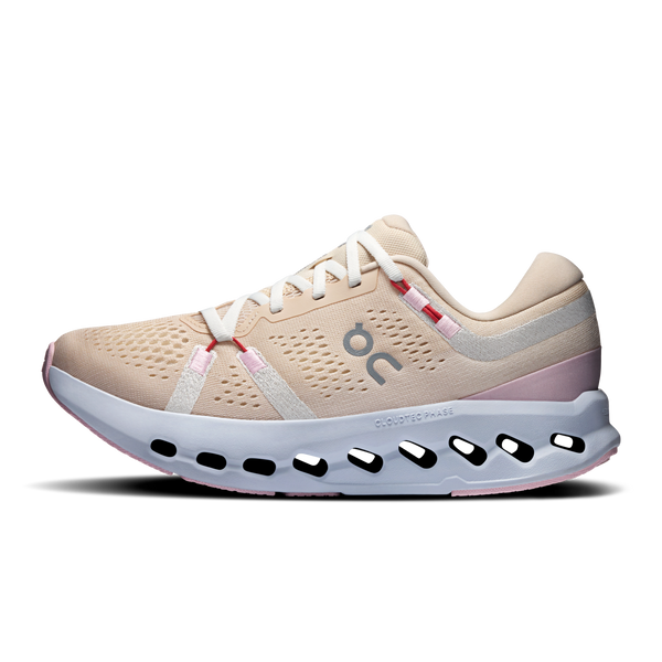 Beige running shoe with white sole on a white background