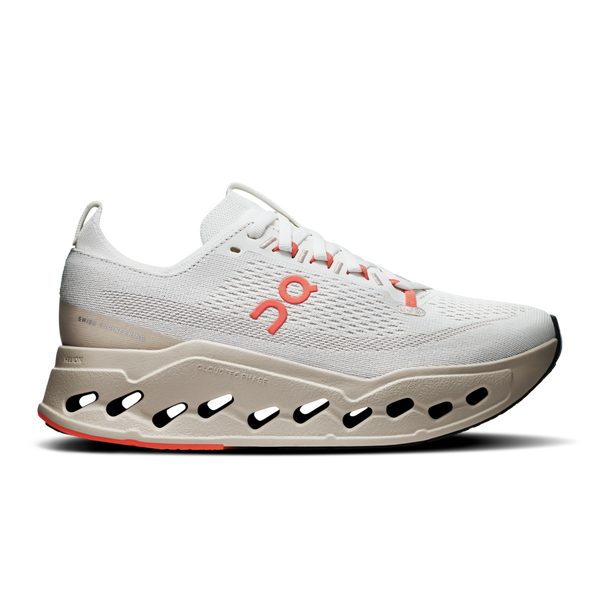 White women's running shoe with a unique sole design on a white background.