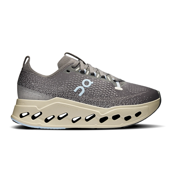 Gray running shoe with a unique sole design on a white background