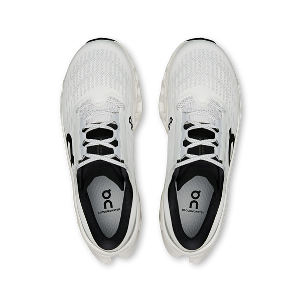 White running shoes with black accents on a white background