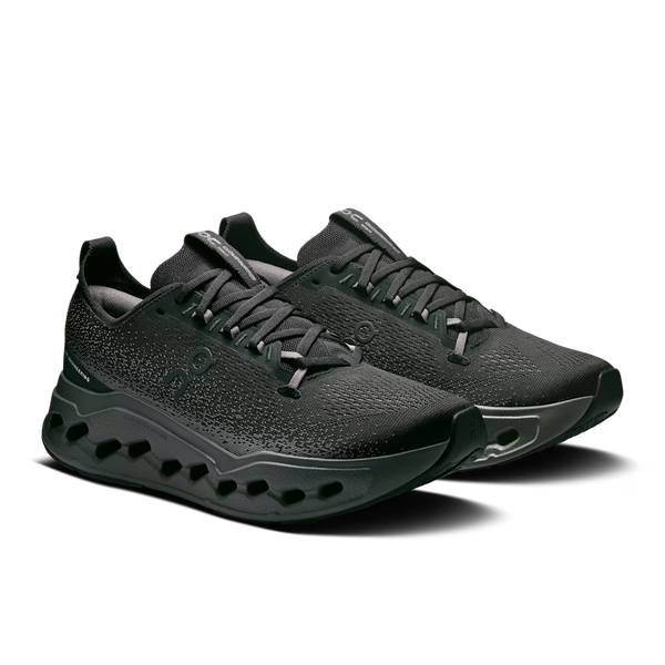 Black athletic shoe with a textured design on a white background