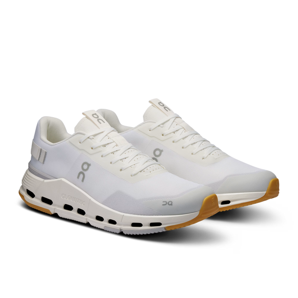 White athletic shoe with visible brand logo on a white background