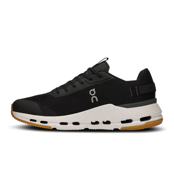 Black running shoe with white sole on a white background