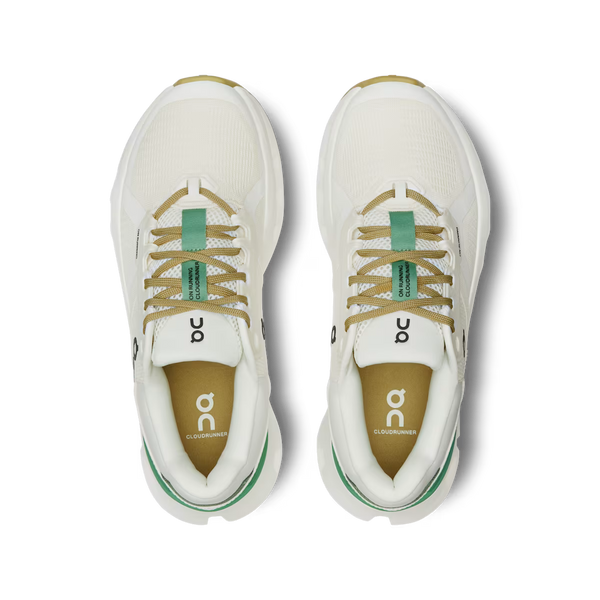 White running shoes with green accents on a transparent background