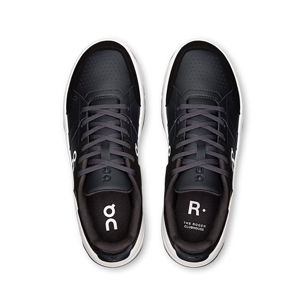 Black athletic shoes with white sole on a white background