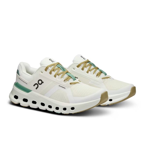 White running shoes with green accents on a transparent background