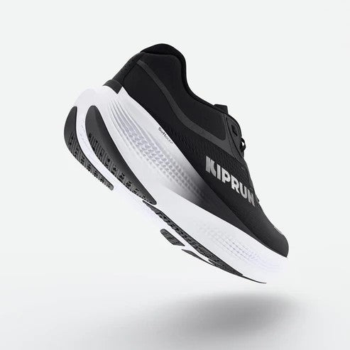 Black and white running shoe with 'Kiprun' branding on a light gray background