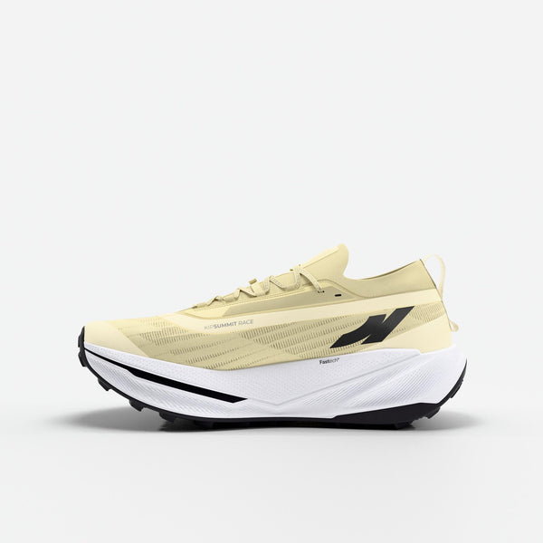 Yellow trail running shoe with white sole on a light gray background
