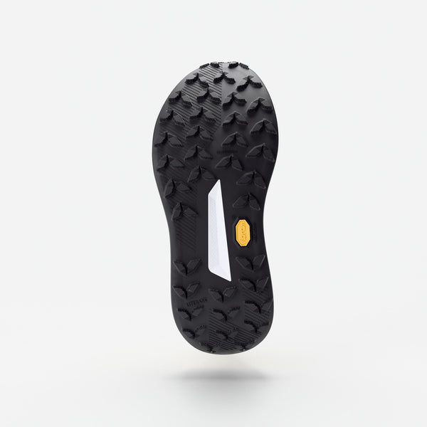 Black shoe sole with tread pattern on a white background