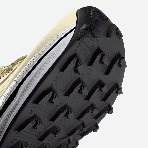 Close-up of a shoe sole with tread pattern on a light background