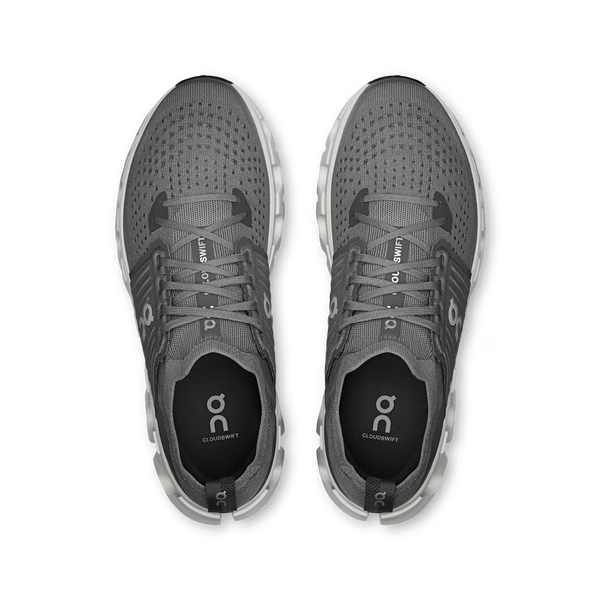 A gray On running shoe with a chunky white and gray CloudTec sole, shown on a white background.