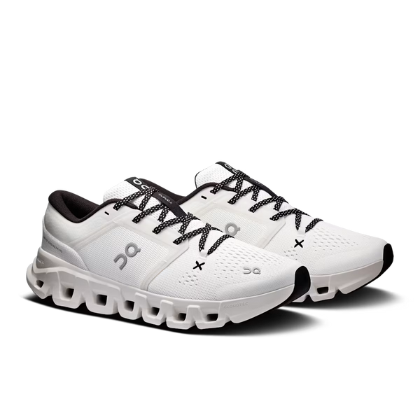 White running shoes with black laces on a white background