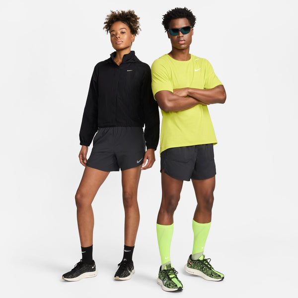 Two people wearing Nike running gear on a white background