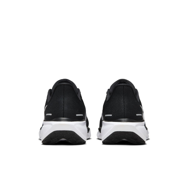 The heel area of this running shoe is all blakc and the midsoleis all white.