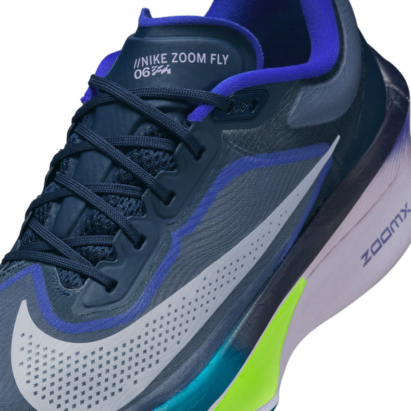 Gray and blue running shoe with Nike Zoom Fly branding on a white background.