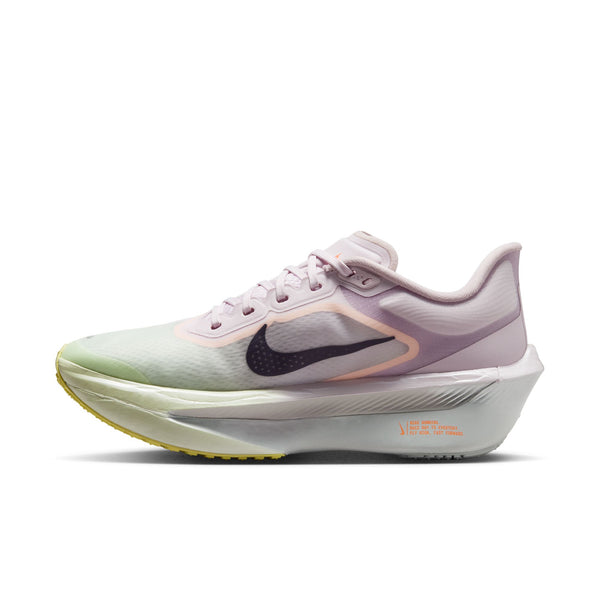 Pink and green running shoe with Nike logo on a white background