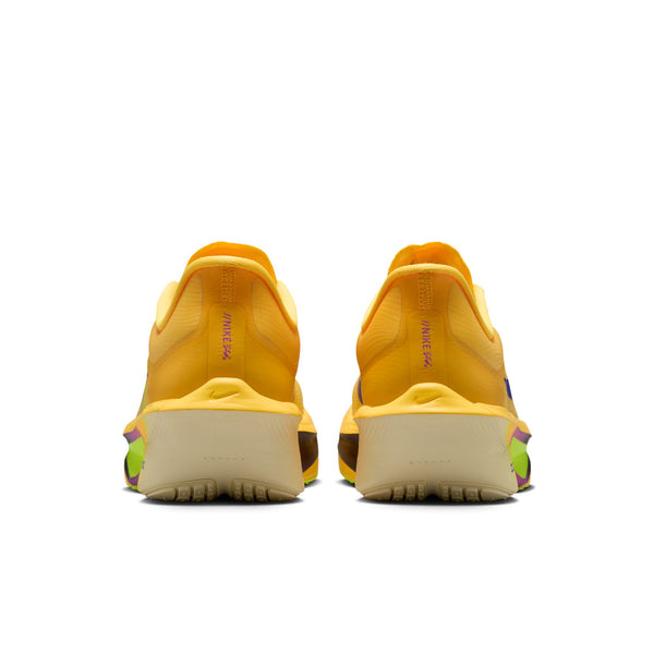 The heel area of a women's nike yellow athletic shoes with a focus on sole design on a white background.
