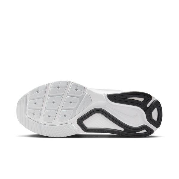 White athletic shoe with black sole on a white background.