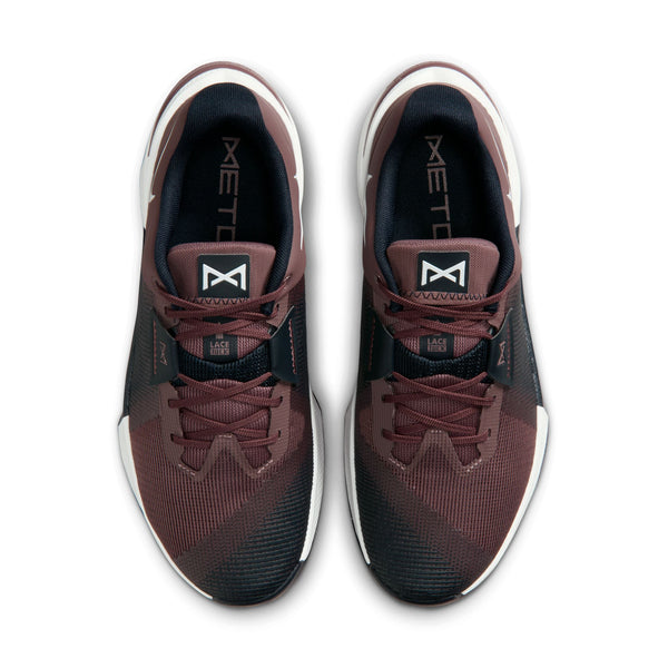 Maroon and black athletic shoe with white sole on a white background