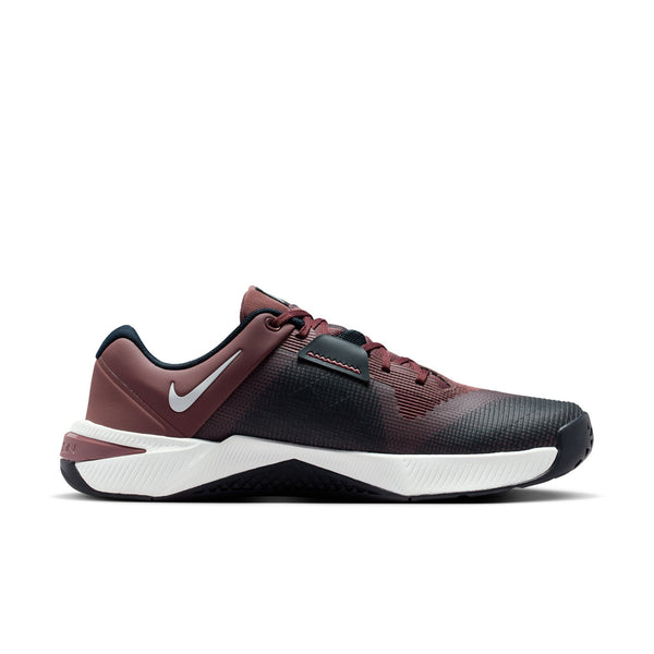 Maroon and black athletic shoe with white sole on a white background