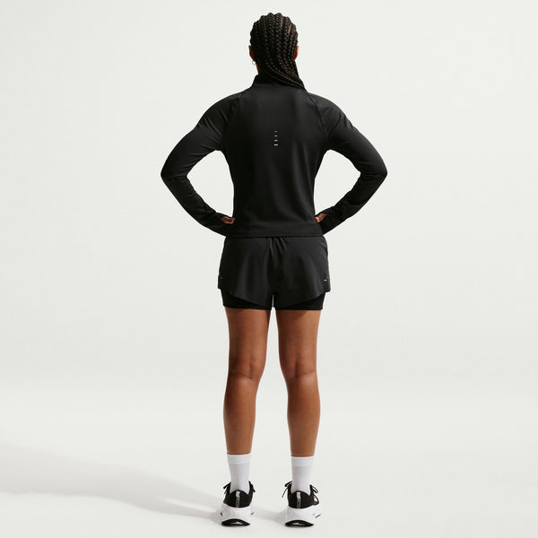 Person wearing a black athletic outfit on a white background