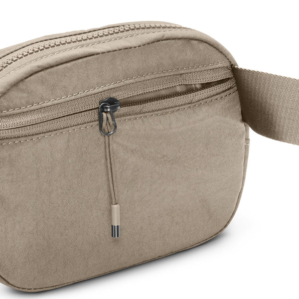 Beige waist bag with a USB port on a white background