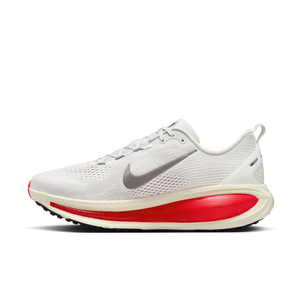 The medial side of this Nike Vomero 18 has white with red on the midsole.