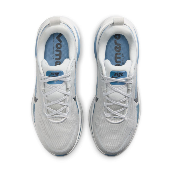 White running shoes with blue soles on a white background
