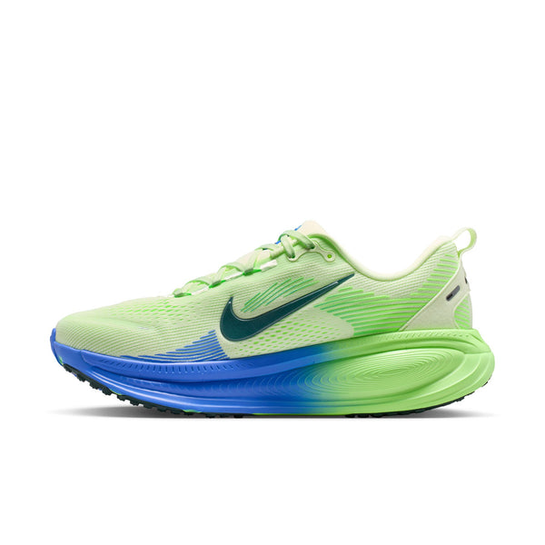 Green and blue running shoe on a white background