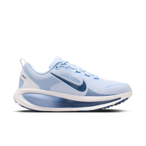 Blue running shoe with white sole on a white background