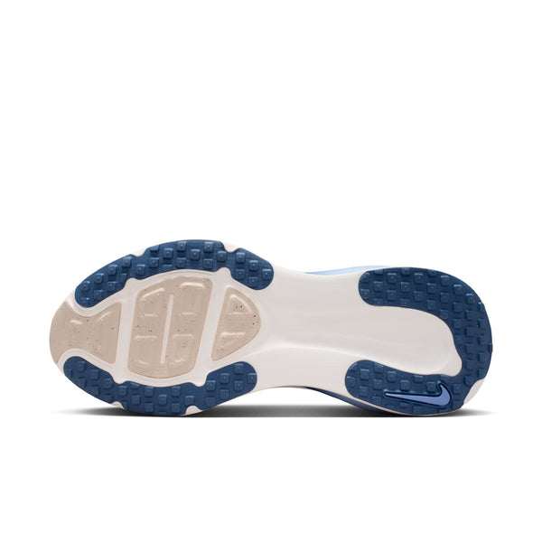 Blue running shoe with white sole on a white background
