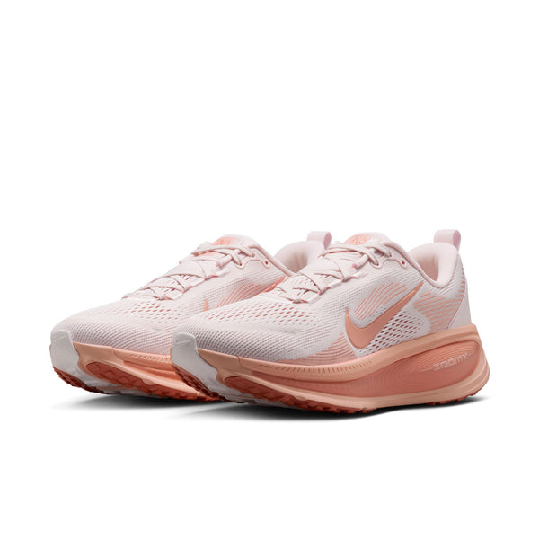 Pair of pink running shoes on a white background.