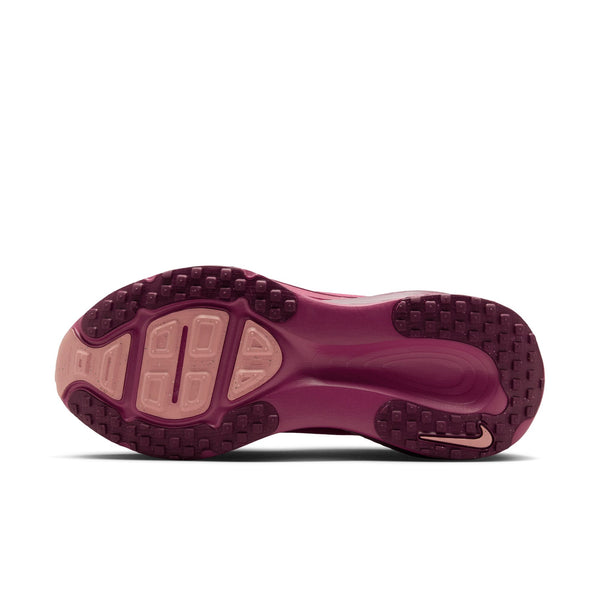 Purple Vomero 18 running shoe outsole with Nike logo on a white background.