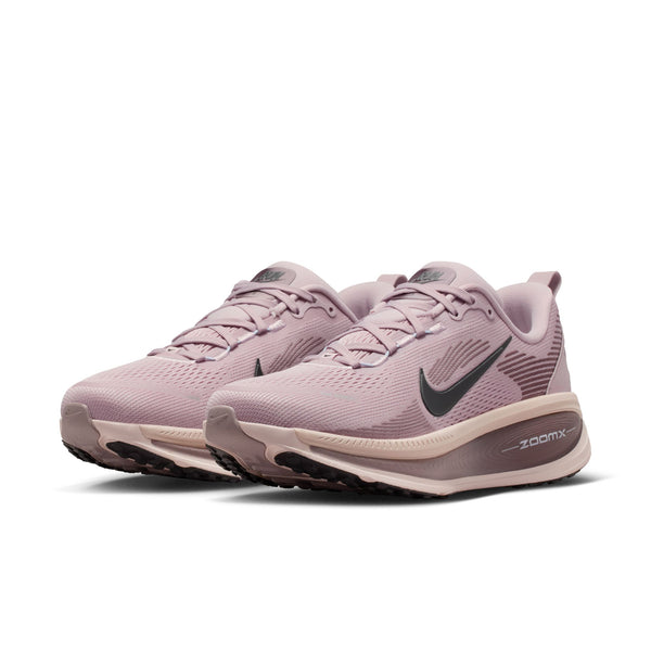 Pair of pink Nike Vomero 18 running shoes on a white background.
