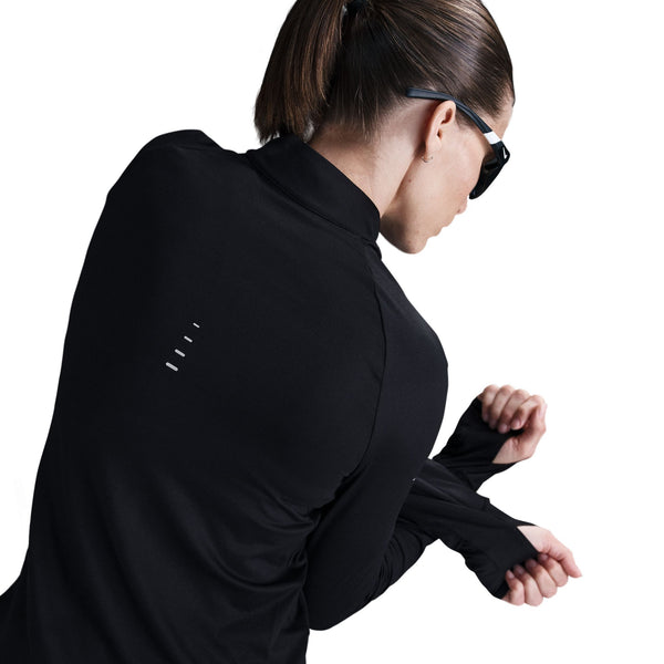 Person wearing a black athletic jacket with a white background