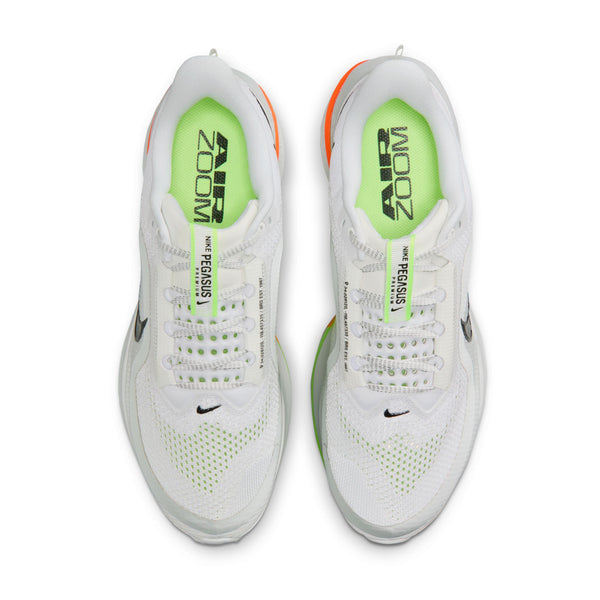 White running shoe with colorful sole on a white background