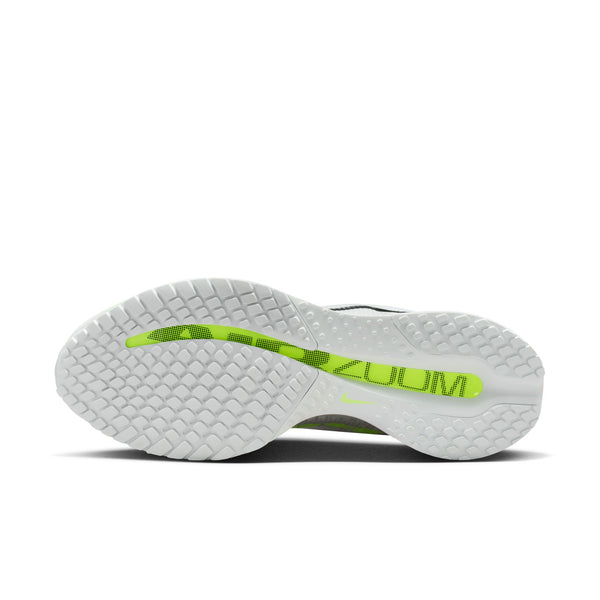 White running shoe with colorful sole on a white background