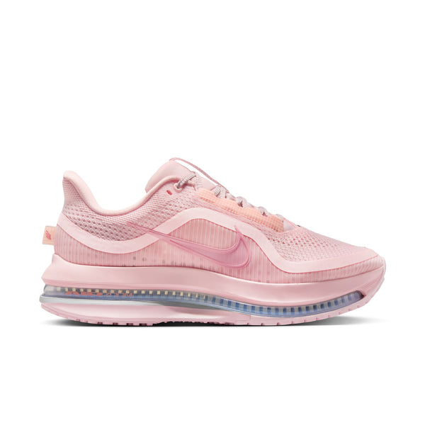 This image features the Women's Pegasus Premium shoe in a striking shade of pink. The shoe boasts a sleek design with a mesh upper that provides breathability, complemented by a sturdy sole unit for enhanced durability.