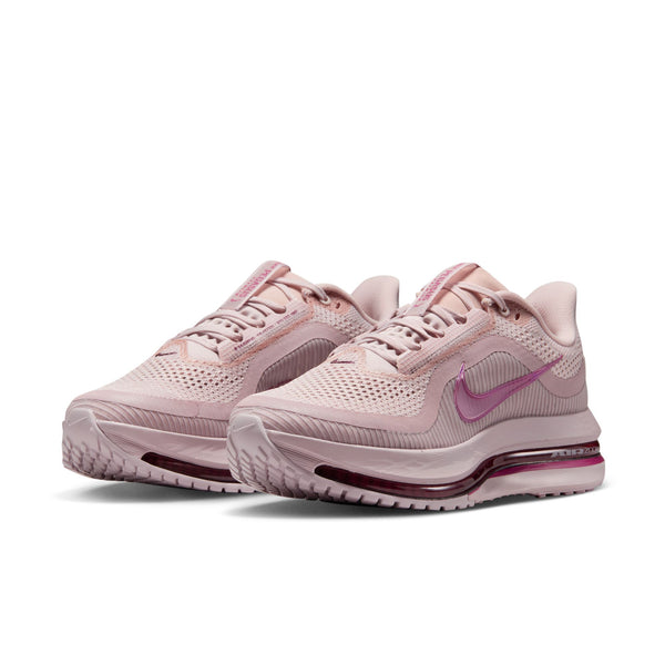 A pair of pink Nike running shoes on a white background.