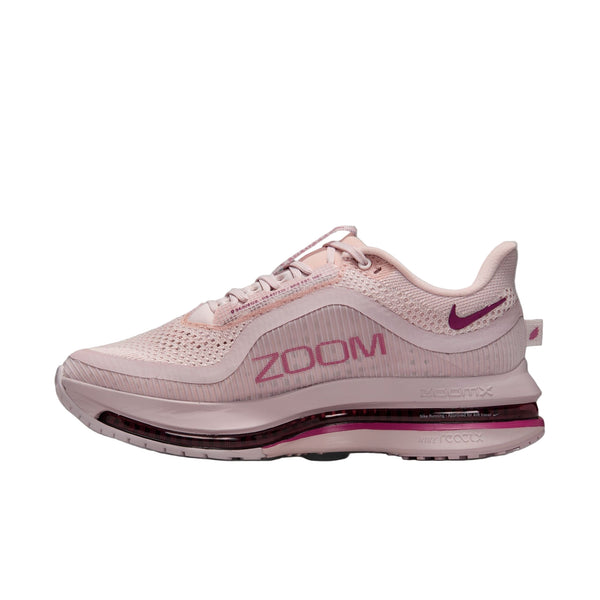 Pink running shoe with 'Zoom' text on a white background.