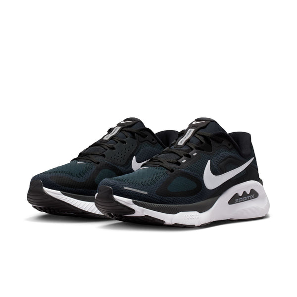 Pair of black and white Nike training shoes on a white background