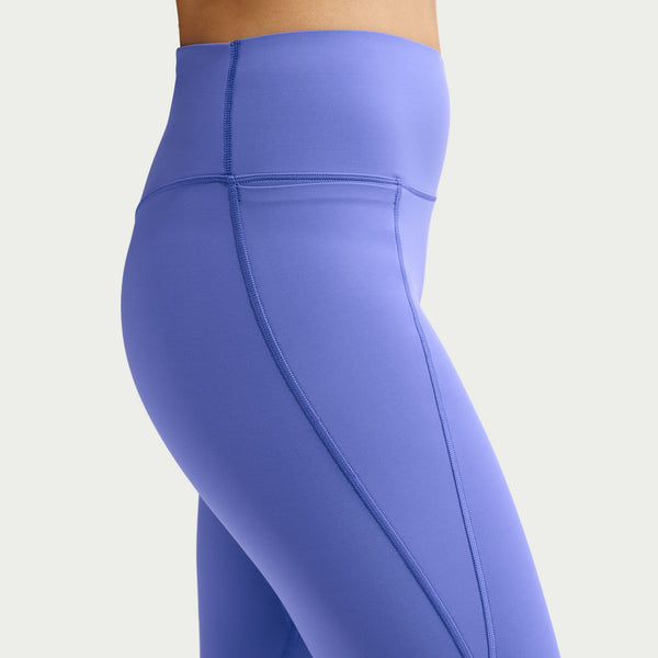 Close-up of purple leggings on a plain background
