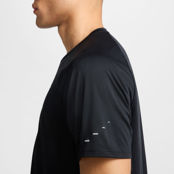 Black t-shirt with distressed details on a plain background