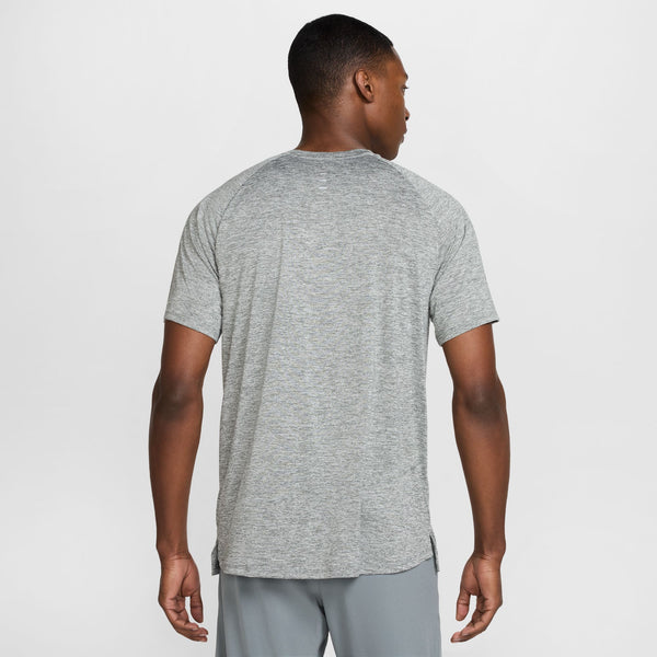 Man wearing a gray t-shirt on a white background