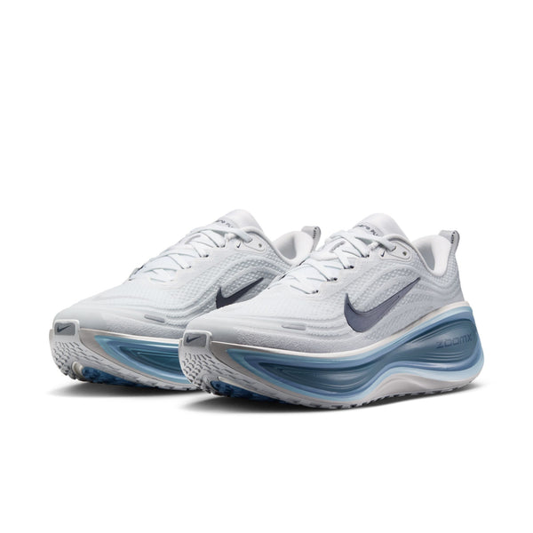 White running shoes with blue sole on a white background