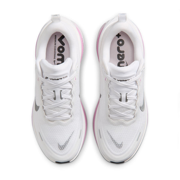 A Nike running shoe in white with a metallic silver Swoosh and a pink ZoomX midsole accent, shown on a white background.