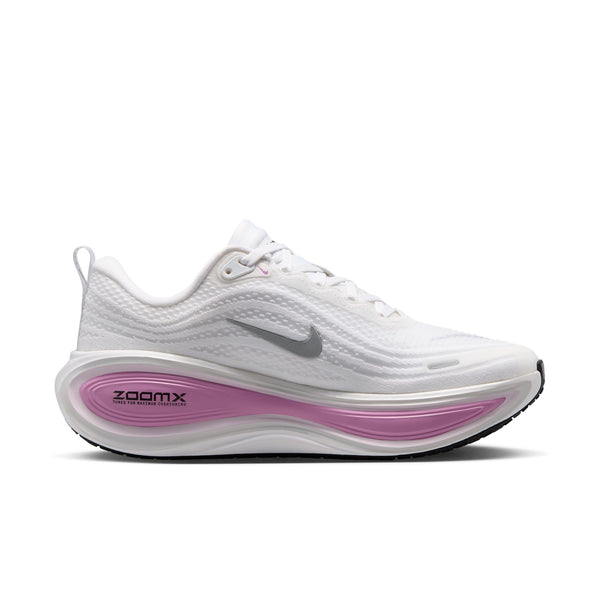 A Nike running shoe in white with a metallic silver Swoosh and a pink ZoomX midsole accent, shown on a white background.