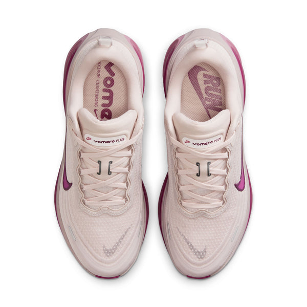 The top down look at a women's Nike running shoe with a white and pink footbed.