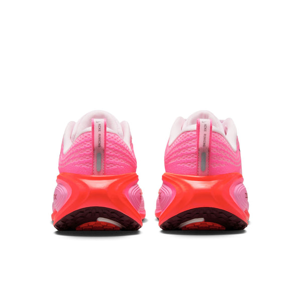 The heel area of this women's Nike shoe is mostly all pink.