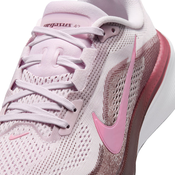 Pink running shoe with Nike logo on a white background
